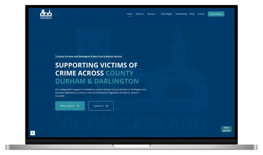 Victim Care & Mentor Service website on a MacBook